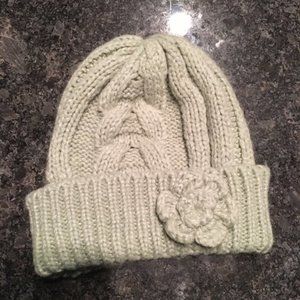 Light gray knit winter hat with flower